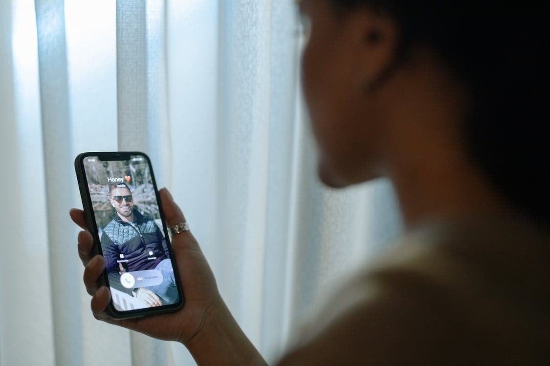 Woman calling his husband on a cell phone