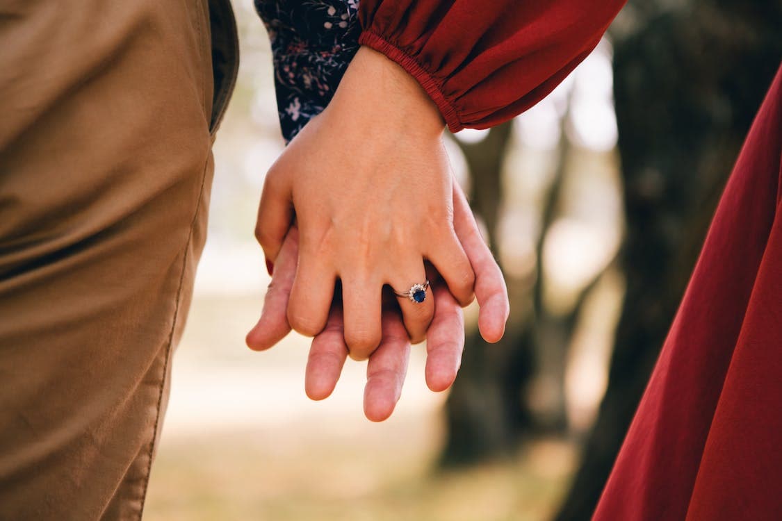 Couple holding hands